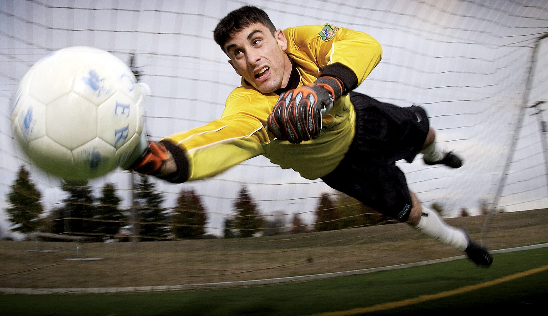 Goalkeeper making a full-stretch diving save